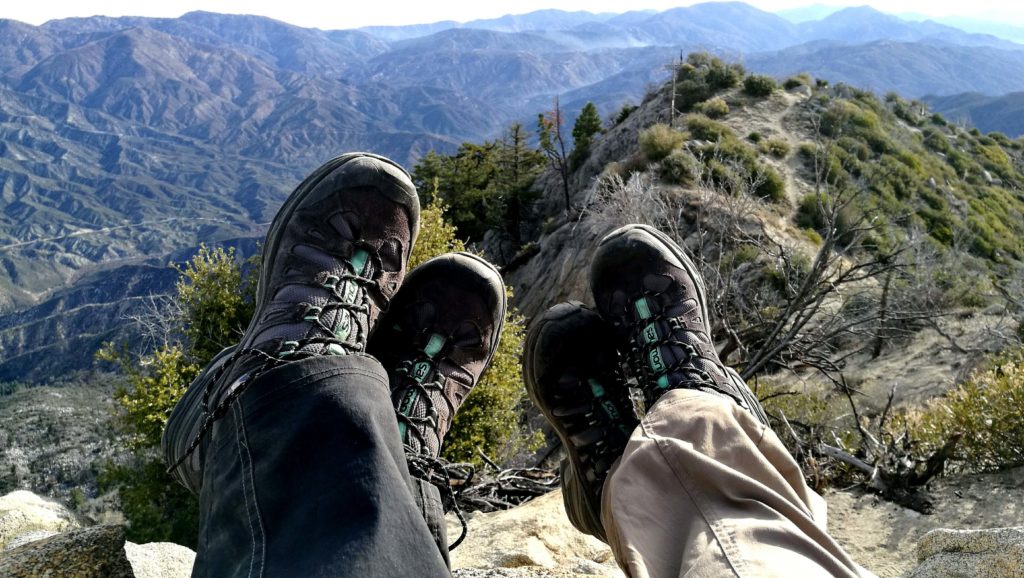 two person wearing hiking shoes