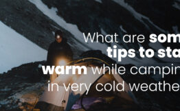 What are some tips to stay warm while camping in very cold weather?