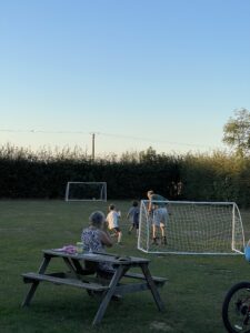 owner playing football with kids Lincolnshire Lanes campsite